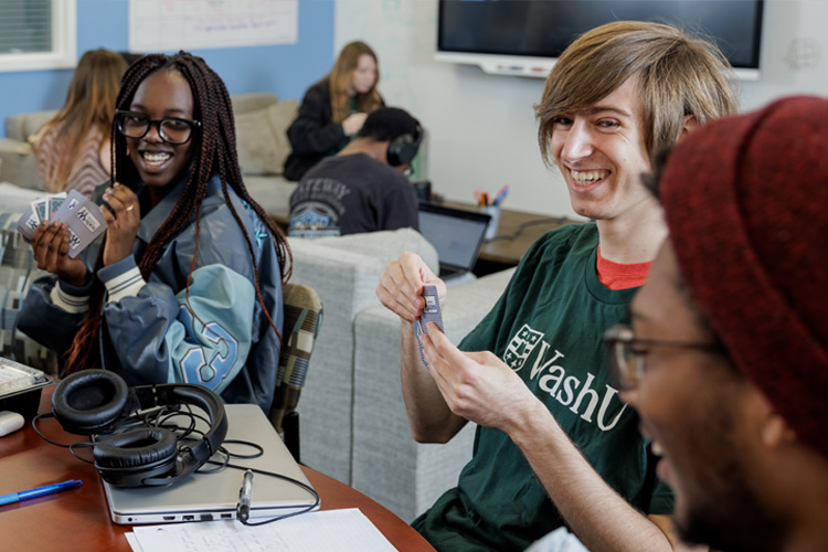 Students playing cards in the TFCSS