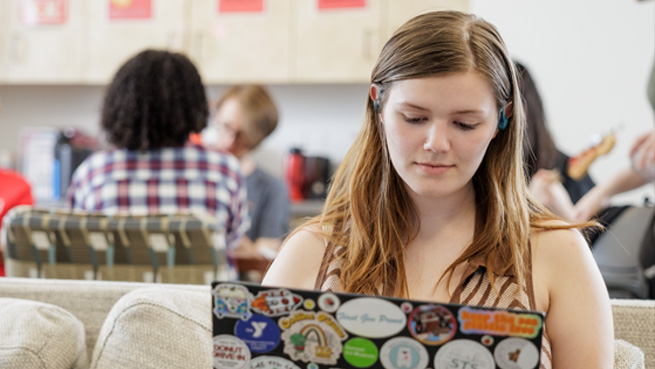 student works on laptop
